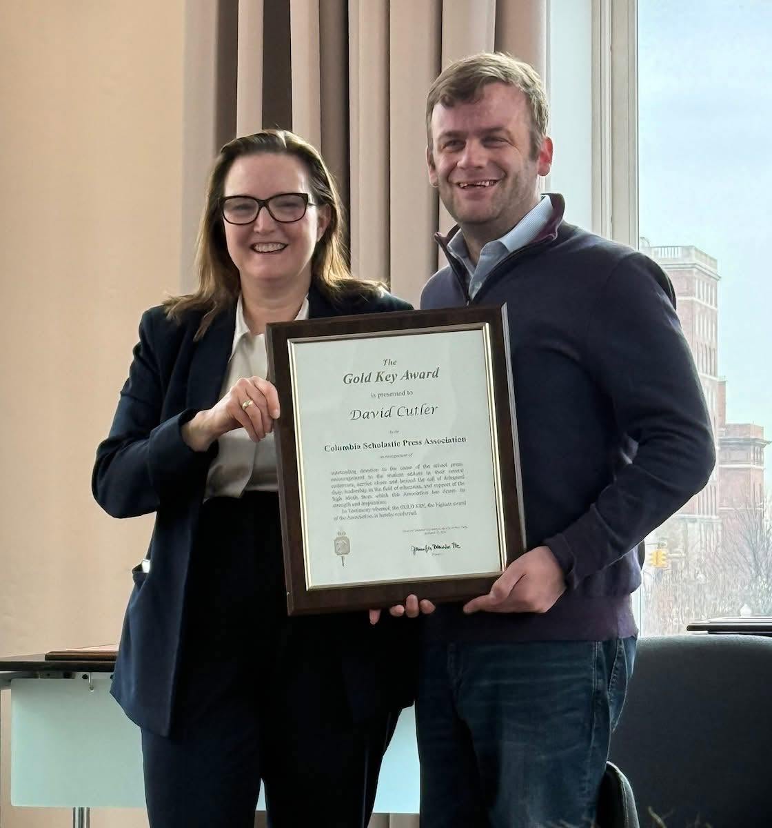 David Cutler and CSPA director Jennifer Ha hold his 2026 Gold Key Award.